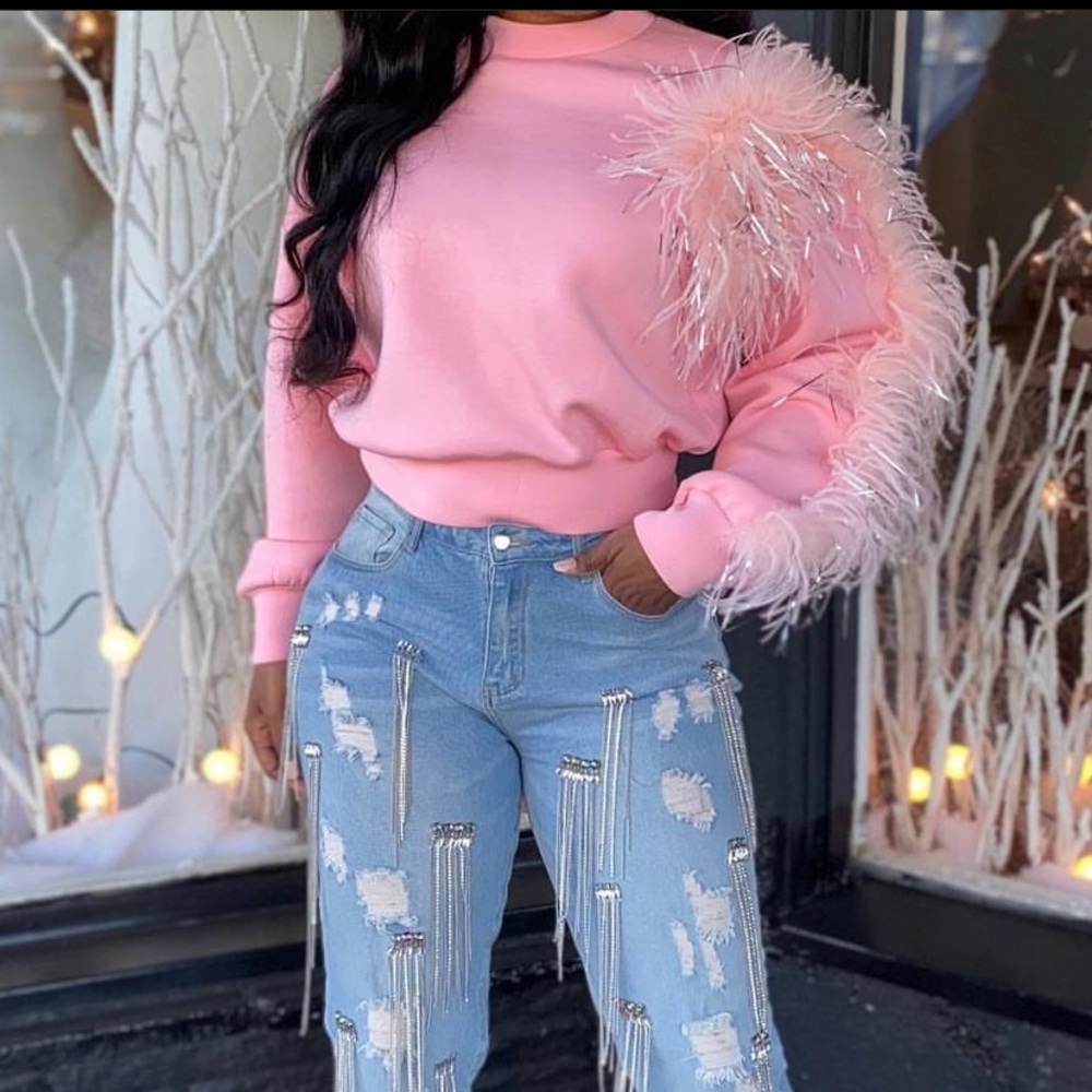 Pink sweater with fuzzies on one side